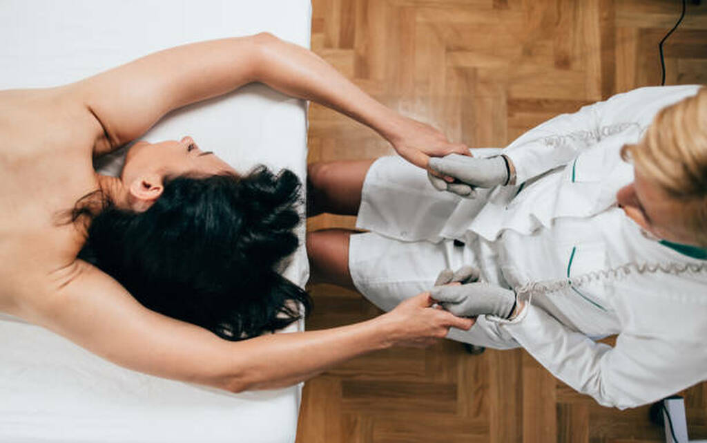 Lymphatic drainage massage assessment by therapist